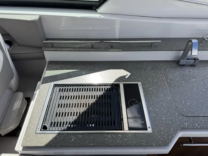 Love You More Yacht Photos Pics 2019 Four Winns 350H boat kitchen with grill and sink on gray countertop.