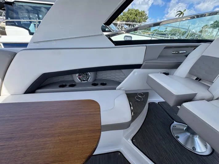 Love You More Yacht Photos Pics 2019 Four Winns 350H boat interior with sleek seating, wooden table, and modern design elements.