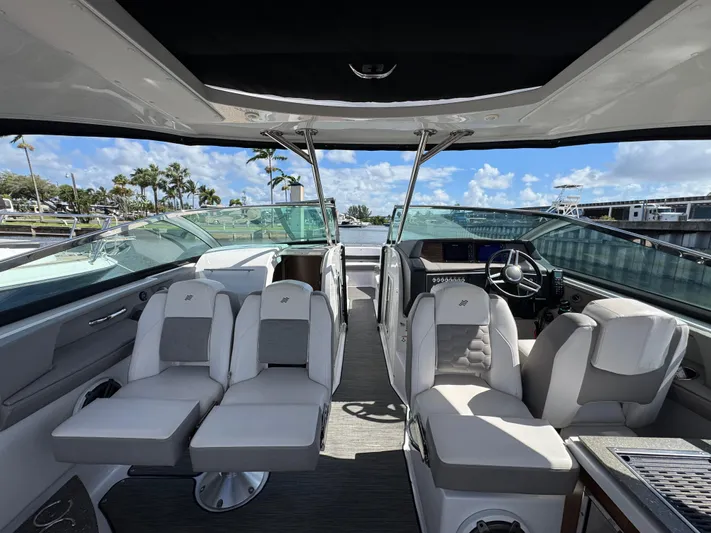 Love You More Yacht Photos Pics 2019 Four Winns 350H boat interior with luxurious seating and modern dashboard.