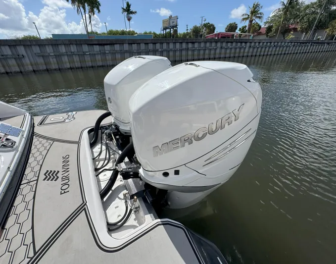 Love You More Yacht Photos Pics 2019 Four Winns 350H boat with dual Mercury outboard engines docked in water.