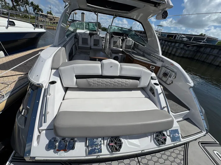 Love You More Yacht Photos Pics 2019 Four Winns 350H boat interior with luxurious seating and modern design at a marina.