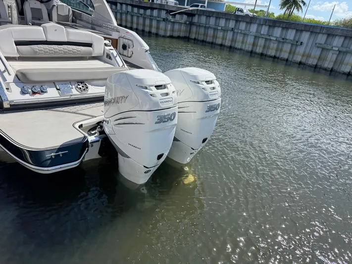 Love You More Yacht Photos Pics 2019 Four Winns 350H boat with twin Mercury Verado 350 engines docked in calm water.