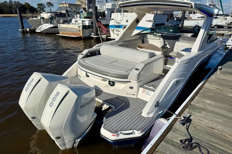  Yacht Photos Pics 2021 Sea Ray SLX 310 Outboard boat docked, featuring dual Mercury engines.