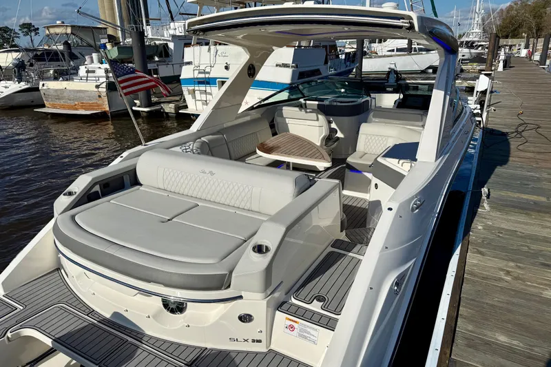  Yacht Photos Pics 2021 Sea Ray SLX 310 Outboard luxury boat docked at marina, featuring spacious seating.