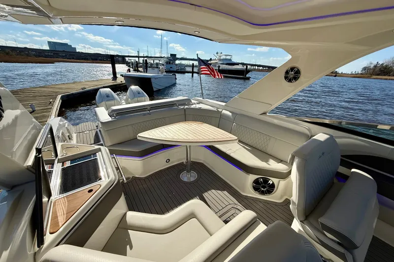  Yacht Photos Pics Luxurious 2021 Sea Ray SLX 310 Outboard boat interior with elegant seating and waterfront view.
