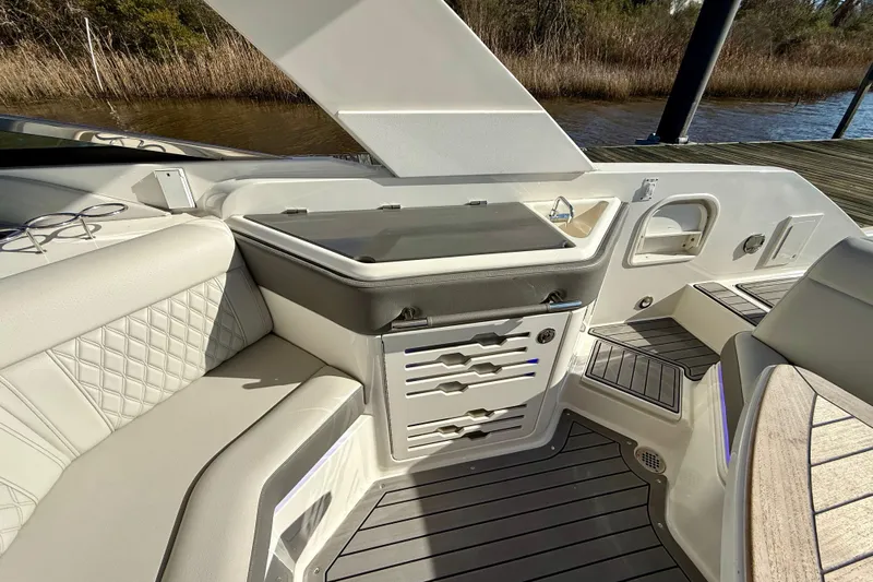  Yacht Photos Pics 2021 Sea Ray SLX 310 Outboard interior with seating, storage, and sleek design.