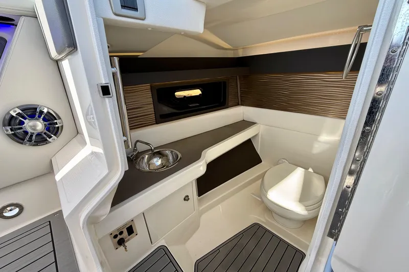  Yacht Photos Pics 2021 Sea Ray SLX 310 Outboard interior with sink, toilet, and modern design.