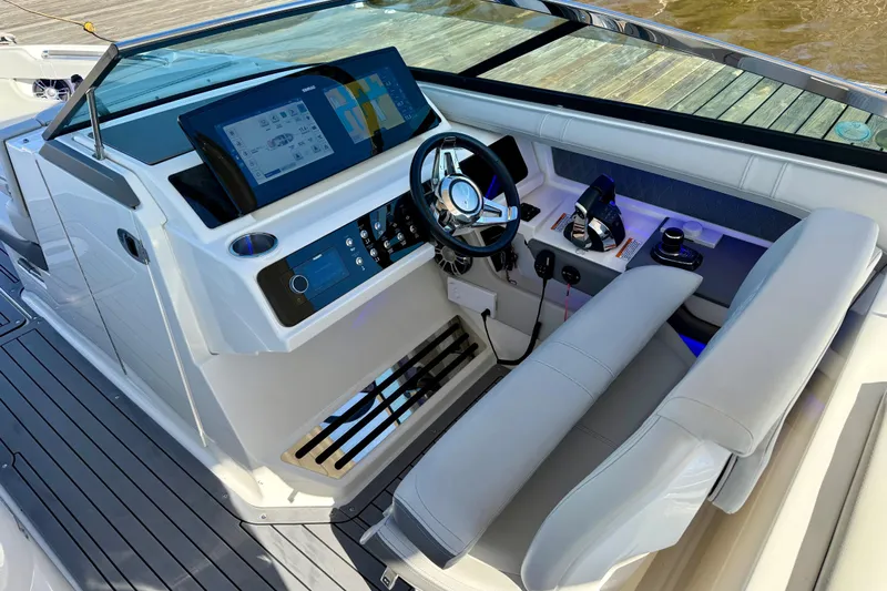  Yacht Photos Pics 2021 Sea Ray SLX 310 Outboard helm with modern controls and navigation display.