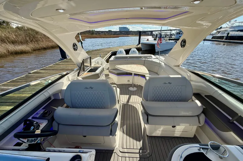  Yacht Photos Pics 2021 Sea Ray SLX 310 Outboard luxury boat interior with plush seating and modern design.