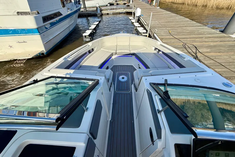  Yacht Photos Pics 2021 Sea Ray SLX 310 Outboard boat docked, featuring spacious seating and sleek design.