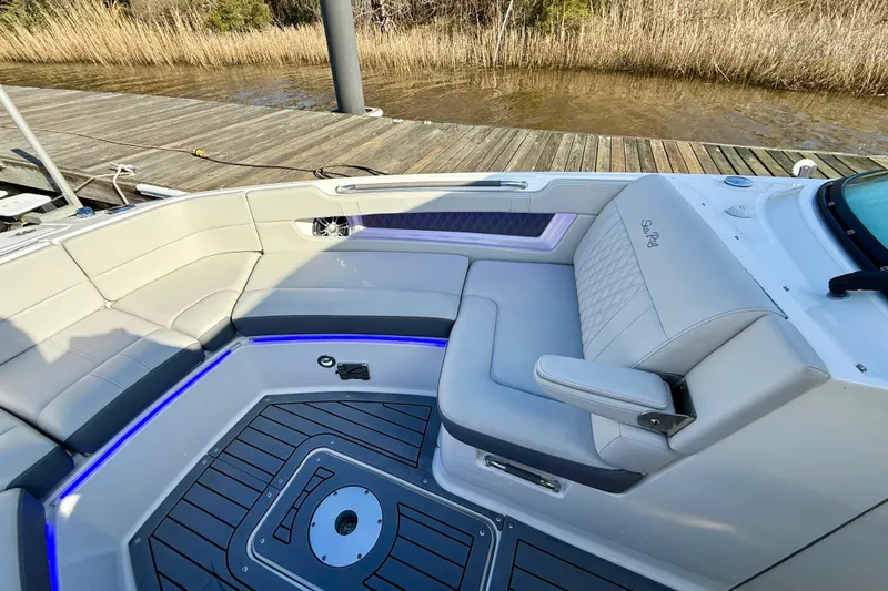  Yacht Photos Pics Luxurious interior of 2021 Sea Ray SLX 310 Outboard boat with elegant seating.