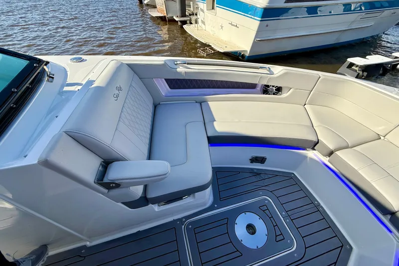  Yacht Photos Pics 2021 Sea Ray SLX 310 Outboard boat interior with luxurious seating and modern design.
