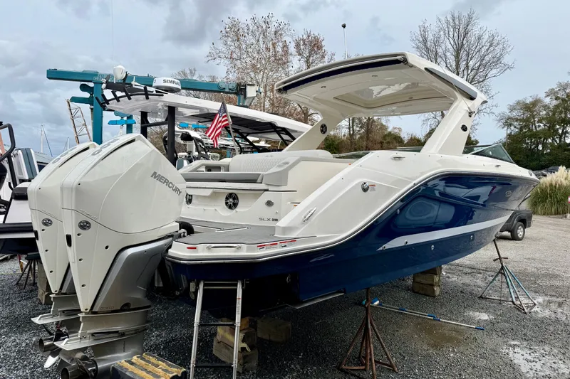  Yacht Photos Pics 2021 Sea Ray SLX 310 Outboard boat with dual Mercury engines on display.