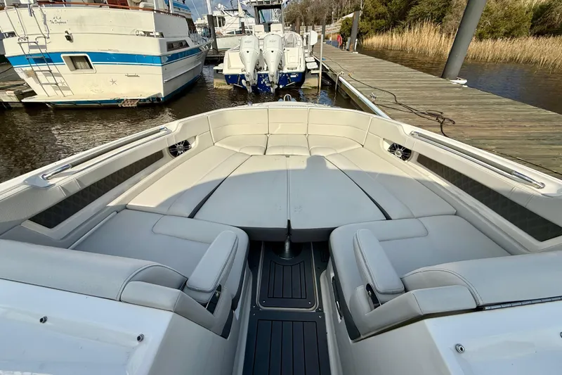  Yacht Photos Pics 2021 Sea Ray SLX 310 Outboard boat interior with spacious seating at dock.