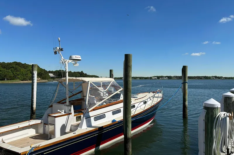 Renegade Yacht Photos Pics 1994 Little Harbor Express boat docked on a sunny day with clear blue skies.