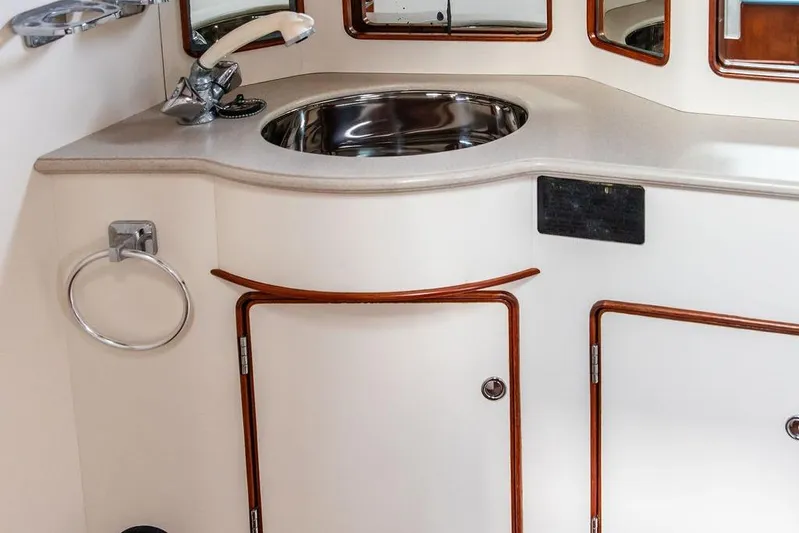 Renegade Yacht Photos Pics 1994 Little Harbor Express yacht interior with sink and storage cabinets.