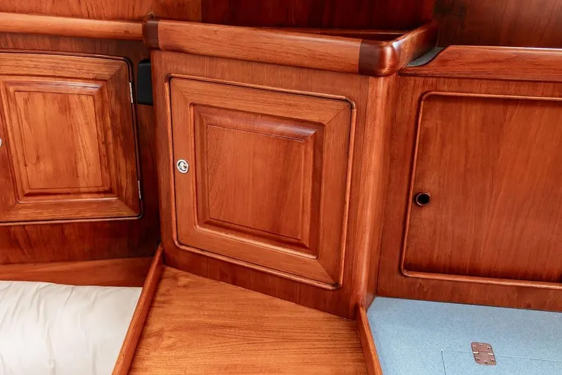 Renegade Yacht Photos Pics 1994 Little Harbor Express interior with polished wooden cabinetry and storage compartments.