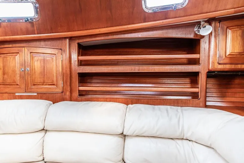 Renegade Yacht Photos Pics Luxurious wooden interior of 1994 Little Harbor Express yacht with white leather seating.