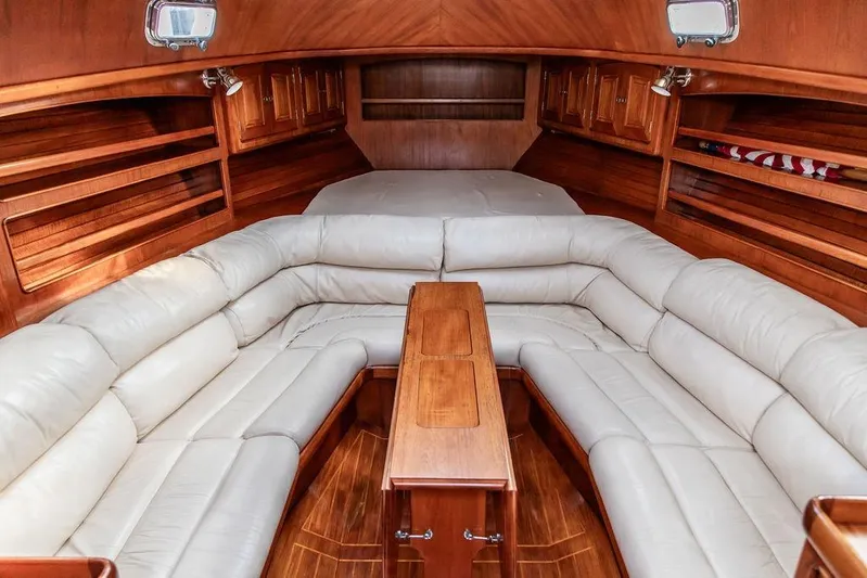 Renegade Yacht Photos Pics Luxurious 1994 Little Harbor Express yacht interior with plush seating and wooden accents.