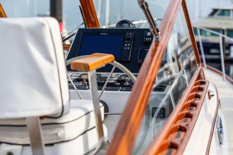Renegade Yacht Photos Pics 1994 Little Harbor Express boat cockpit with wooden trim and modern navigation equipment.