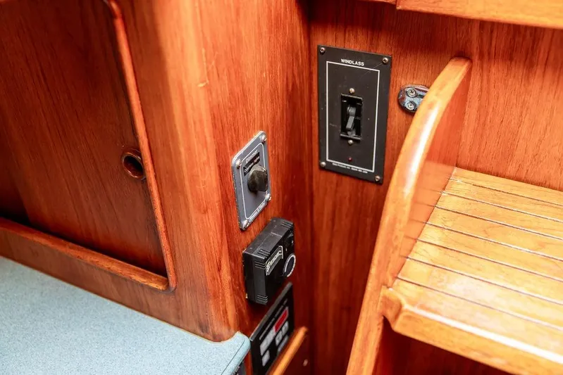 Renegade Yacht Photos Pics 1994 Little Harbor Express interior with wooden paneling and control switches.