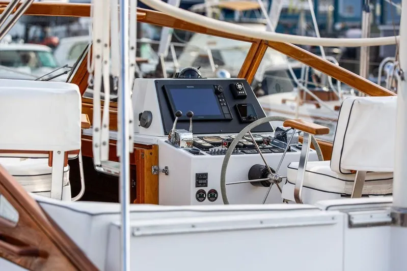 Renegade Yacht Photos Pics 1994 Little Harbor Express yacht helm with modern navigation equipment and wooden accents.