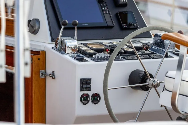 Renegade Yacht Photos Pics Control panel of a 1994 Little Harbor Express boat with steering wheel and navigation instruments.