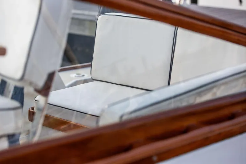 Renegade Yacht Photos Pics 1994 Little Harbor Express boat with white cushioned seating and wooden trim.