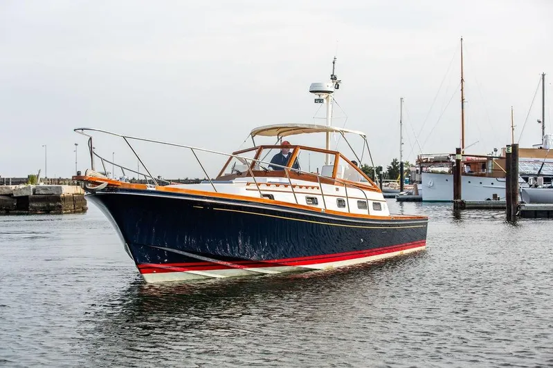 Renegade Yacht Photos Pics 1994 Little Harbor Express boat cruising in a marina, featuring classic design and elegant lines.