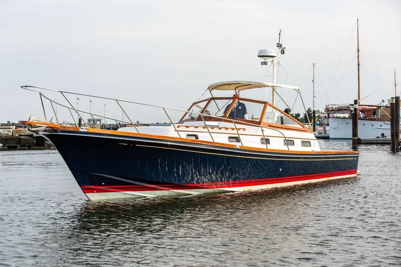 Renegade Yacht Photos Pics 1994 Little Harbor Express yacht on calm water, featuring sleek design and classic styling.