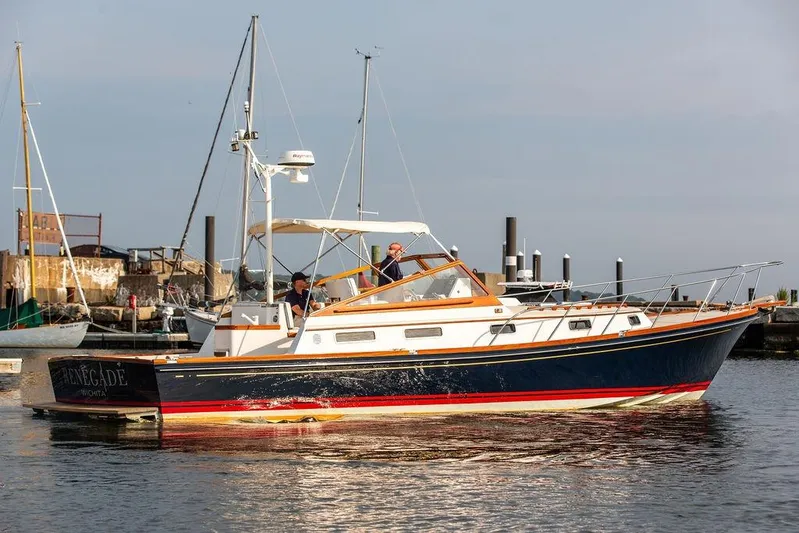 Renegade Yacht Photos Pics 1994 Little Harbor Express boat docked in a marina, featuring classic design and elegant detailing.