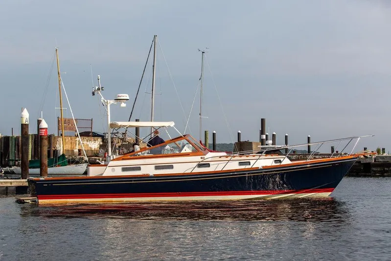 Renegade Yacht Photos Pics 1994 Little Harbor Express yacht docked at a marina, side view.