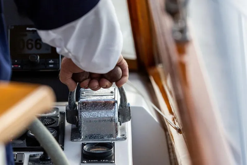 Renegade Yacht Photos Pics Hand operating throttle on 1994 Little Harbor Express boat, close-up view.
