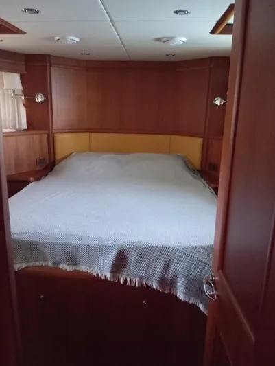 Saturnia Yacht Photos Pics Luxurious cabin interior of 2009 Grand Banks 59 Aleutian RP yacht with cozy bed.