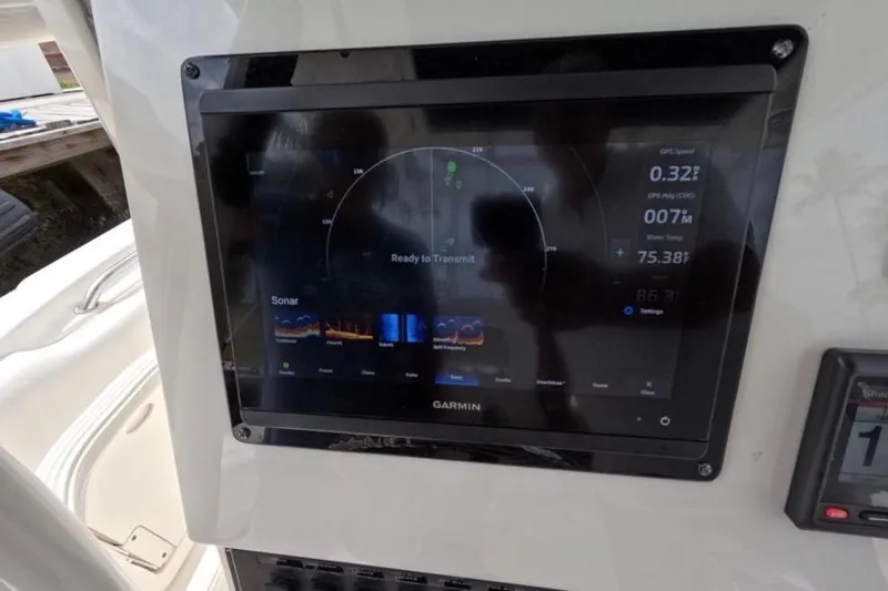 32 Boston Whaler Outrage 2013 Yacht Photos Pics Garmin display on 2013 Boston Whaler 320 Outrage boat, showing sonar and navigation data.