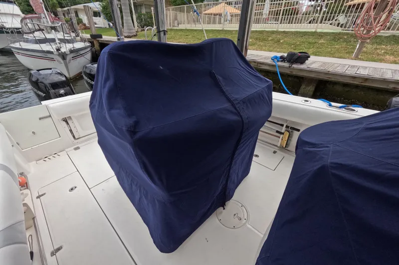 32 Boston Whaler Outrage 2013 Yacht Photos Pics 2013 Boston Whaler 320 Outrage boat interior with covered seats at dock.