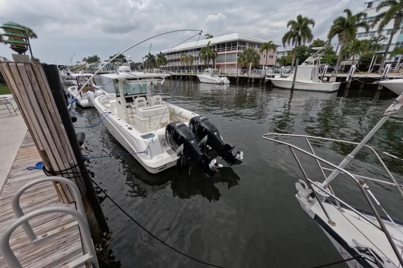 32 Boston Whaler Outrage 2013 Yacht Photos Pics 2013 Boston Whaler 320 Outrage docked at marina with twin outboard engines.