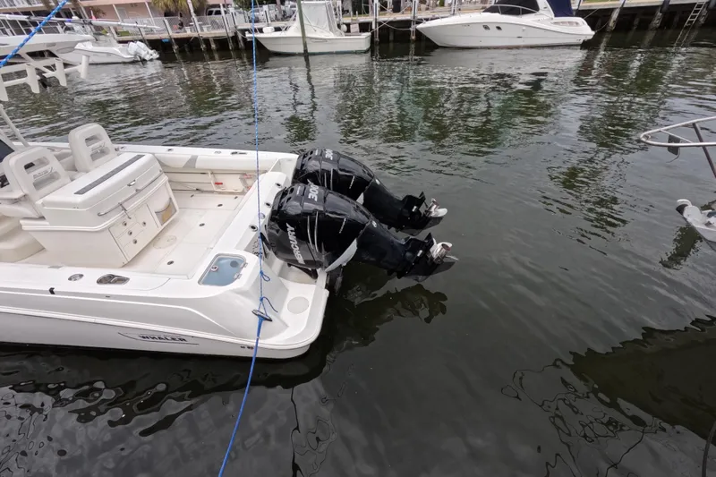 32 Boston Whaler Outrage 2013 Yacht Photos Pics 2013 Boston Whaler 320 Outrage with dual outboard engines docked in marina.