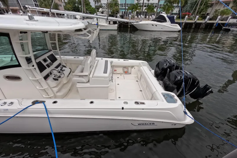 32 Boston Whaler Outrage 2013 Yacht Photos Pics 2013 Boston Whaler 320 Outrage boat docked with dual outboard engines.