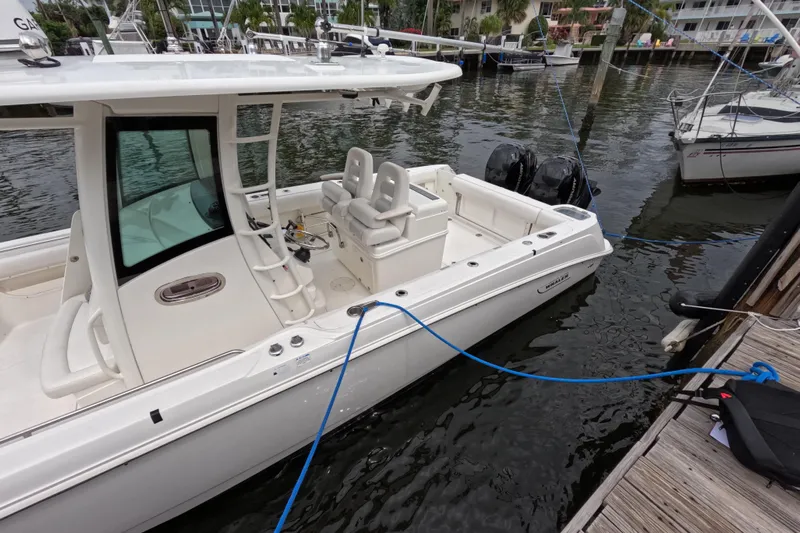 32 Boston Whaler Outrage 2013 Yacht Photos Pics 2013 Boston Whaler 320 Outrage docked at marina, side view.