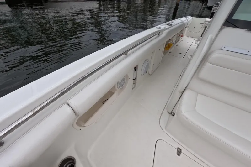 32 Boston Whaler Outrage 2013 Yacht Photos Pics 2013 Boston Whaler 320 Outrage boat interior with white seating and storage compartments.