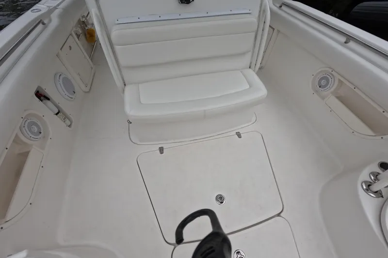 32 Boston Whaler Outrage 2013 Yacht Photos Pics 2013 Boston Whaler 320 Outrage boat interior with white seating and storage compartments.