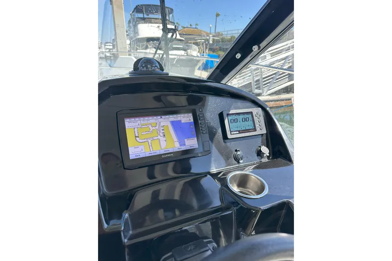 Destination Unknown II Yacht Photos Pics 2021 Jeanneau NC895 helm with Garmin navigation system and digital display.