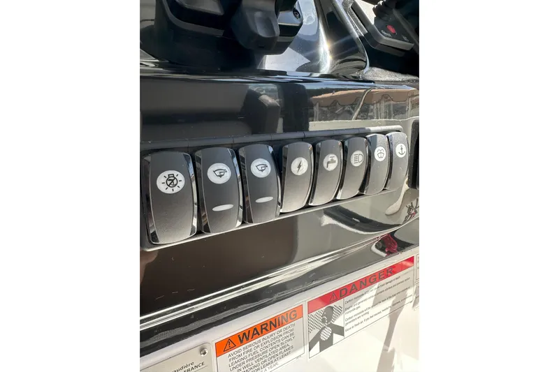 Destination Unknown II Yacht Photos Pics Control panel of a 2021 Jeanneau NC895 boat with labeled switches.