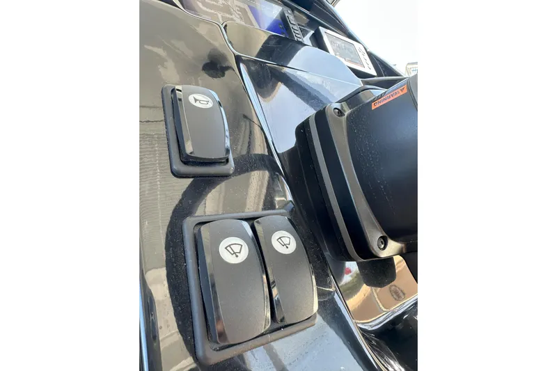 Destination Unknown II Yacht Photos Pics Control panel of 2021 Jeanneau NC895 boat with switches and buttons.