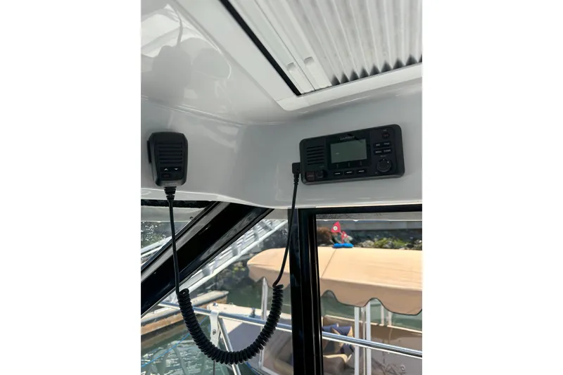 Destination Unknown II Yacht Photos Pics Interior view of 2021 Jeanneau NC895 boat with Garmin marine radio system.