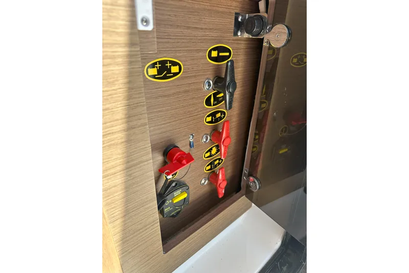 Destination Unknown II Yacht Photos Pics Control panel of 2021 Jeanneau NC895 boat with labeled switches and indicators.