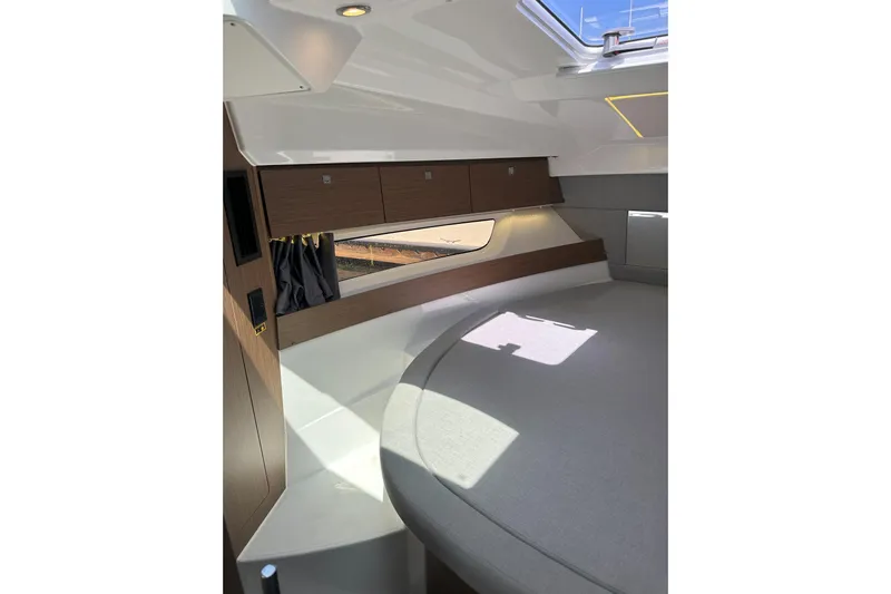 Destination Unknown II Yacht Photos Pics Interior cabin of 2021 Jeanneau NC895 boat with modern design and natural light.