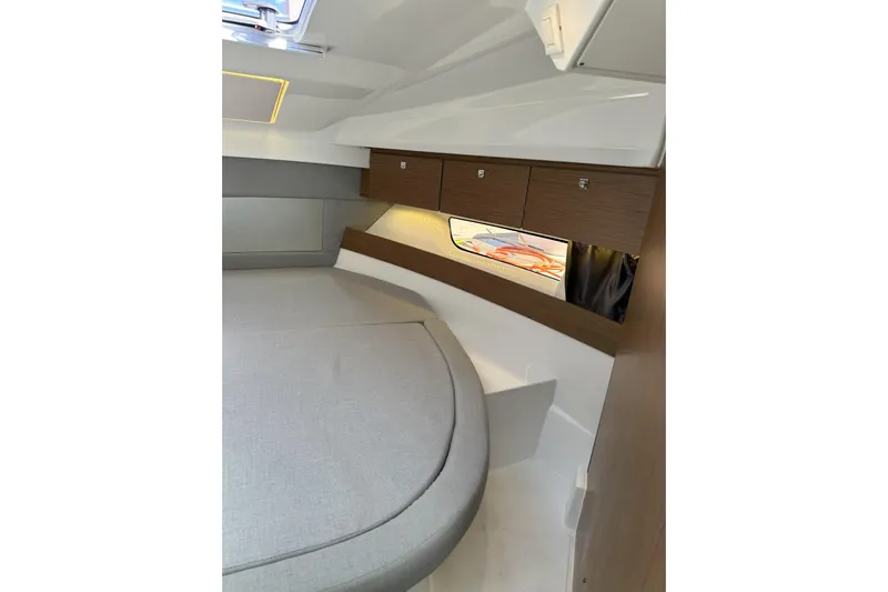 Destination Unknown II Yacht Photos Pics 2021 Jeanneau NC895 cabin interior with modern design and wood accents.