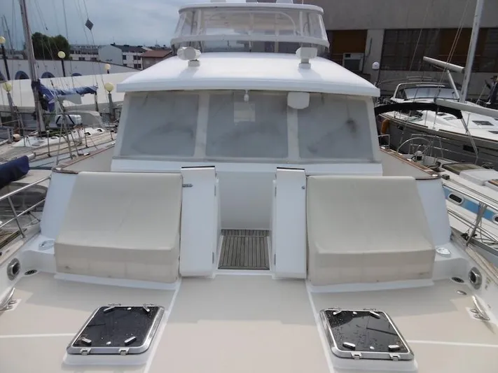 Saturnia Yacht Photos Pics 2009 Grand Banks 59 Aleutian RP yacht with spacious deck and seating area.